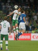 18 June 2012; Kevin Doyle, Republic of Ireland, and Daniele De Rossi, Italy, contest a high ball. EURO2012, Group C, Republic of Ireland v Italy, Municipal Stadium Poznan, Poznan, Poland. Picture credit: Brendan Moran / SPORTSFILE