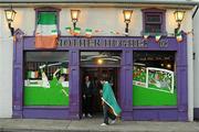 18 June 2012; A Republic of Ireland supporter walks past Mother Hughes pub in Drogheda during the EURO2012, Group C, game between the Republic of Ireland and Italy. Photo by Sportsfile