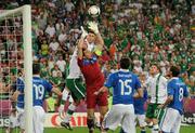 18 June 2012; Italy goalkeeper Gianluigi Buffon takes the ball despite the efforts of Republic of Ireland players Richard Dunne, left, and Shane Long. EURO2012, Group C, Republic of Ireland v Italy, Municipal Stadium Poznan, Poznan, Poland. Picture credit: David Maher / SPORTSFILE