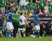 18 June 2012; Keith Andrews, Republic of Ireland, kicks the ball away after being sent off for a second yellow card. EURO2012, Group C, Republic of Ireland v Italy, Municipal Stadium Poznan, Poznan, Poland. Picture credit: David Maher / SPORTSFILE