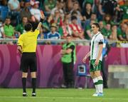 18 June 2012; Keith Andrews, Republic of Ireland, is shown the red card for a second bookable offence. EURO2012, Group C, Republic of Ireland v Italy, Municipal Stadium Poznan, Poznan, Poland. Picture credit: David Maher / SPORTSFILE