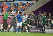 18 June 2012; Keith Andrews, Republic of Ireland, kicks the ball away after being sent off for a second yellow card. EURO2012, Group C, Republic of Ireland v Italy, Municipal Stadium Poznan, Poznan, Poland. Picture credit: Brendan Moran / SPORTSFILE