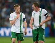 18 June 2012; Republic of Ireland captain Damien Duff, left, and team mate Richard Dunne after the game. EURO2012, Group C, Republic of Ireland v Italy, Municipal Stadium Poznan, Poznan, Poland. Picture credit: David Maher / SPORTSFILE