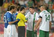 18 June 2012; Robbie Keane, Republic of Ireland, 10, remonstrates with the referee after he sent off Keith Andrews for a second bookable offence. EURO2012, Group C, Republic of Ireland v Italy, Municipal Stadium Poznan, Poznan, Poland. Picture credit: Brendan Moran / SPORTSFILE