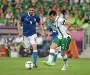 18 June 2012; Sean St. Ledger, Republic of Ireland, in action against Thiago Motta, Italy. EURO2012, Group C, Republic of Ireland v Italy, Municipal Stadium Poznan, Poznan, Poland. Picture credit: Brendan Moran / SPORTSFILE