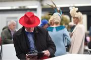 10 September 2017; A sharp-dressed punter studies the form at the Longines Irish Champions Weekend 2017 at The Curragh Racecourse in Co Kildare. Photo by Cody Glenn/Sportsfile