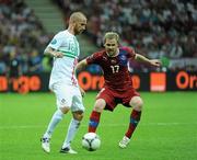 21 June 2012; Raul Meireles, Portugal, in action against Tomas Hubschmann, Czech Republic. UEFA EURO 2012, Quarter-Final, Czech Republic v Portugal, National Stadium, Warsaw, Poland. Picture credit: Pat Murphy / SPORTSFILE