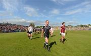 9 June 2012; The Sligo captain, Ross Donovan, and the Galway captain, Finian Hanley, lead their team-mates in the pre match parade. Connacht GAA Football Senior Championship, Semi-Final, Galway v Sligo, Pearse Stadium, Galway. Picture credit: Ray McManus / SPORTSFILE