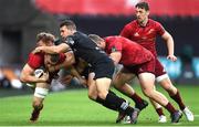 16 September 2017; Tommy O'Donnell of Munster is tackled by Jeff Hassler and Tom Habberfield of Ospreys during the Guinness PRO14 Round 3 match between Ospreys and Munster at Liberty Stadium in Swansea. Photo by Ben Evans/Sportsfile