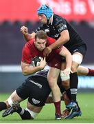 16 September 2017; Chris Farrell of Munster is tackled by Justin Tipuric, right, and Dan Lydiate of Ospreys during the Guinness PRO14 Round 3 match between Ospreys and Munster at Liberty Stadium in Swansea. Photo by Ben Evans/Sportsfile