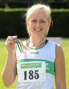 24 June 2012; Sarah Lavin, Emerald A.C., Co. Limerick, with her Gold medal after winning the Junior Women's 100m hurdles at the Woodie's DIY Junior and U23 Track and Field Championships of Ireland, Tullamore Harriers A.C., Tullamore, Co. Offaly. Picture credit: Matt Browne / SPORTSFILE