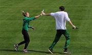 26 June 2012; Ireland's Joanna Mills goes through the baton changeover for the 4x400m relay with Kevin Ankrom, High Performance Director, Athletics Ireland, on the warm-up track ahead of the European Championships. Previews to the European Athletics Championships, Olympic Stadium, Helsinki, Finland. Picture credit: Brendan Moran / SPORTSFILE