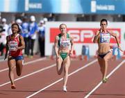 27 June 2012; Ireland's Amy Foster in action alongside Ezinne Okparaebo, left, Norway, and Andreea Ograzeanu, right, Romania, during her heat of the Women's 100m, where she finished 7th in a time of 11.58sec. European Athletics Championship, Day 1. Olympic Stadium, Helsinki, Finland. Picture credit: Brendan Moran / SPORTSFILE