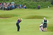 27 June 2012; Padraig Harrington, plays his second shot to the 7th green watches by his caddy Ronan Flood during the 2012 Irish Open Golf Championship Pro-Am. Royal Portrush, Portrush, Co. Antrim. Picture credit: Matt Browne / SPORTSFILE