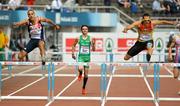 28 June 2012; Ireland's Thomas Barr in action alongside Nathan Woodward, left, Great Britain, and Georg Fleischhauer, of Germany, during his semi-final of the Men's 400m Hurdles where he finished 5th in a season best time of 50.22sec. European Athletics Championship, Day 2, Olympic Stadium, Helsinki, Finland. Picture credit: Brendan Moran / SPORTSFILE