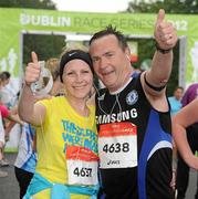 30 June 2012; Jenny O'Grady, with her Father Gerry, from Swords, Co. Dublin, after finishing the Irish Runner 5 Mile Road Race. Phoenix Park, Dublin. Picture credit: Tomas Greally / SPORTSFILE