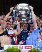 17 September 2017; James McCarthy, left, and Diarmuid Connolly of Dublin lift the Sam Maguire with the help of Kiaran O'Mahony, son of Dublin team doctor Dr. Kieran O'Mahony, after the GAA Football All-Ireland Senior Championship Final match between Dublin and Mayo at Croke Park in Dublin. Photo by Brendan Moran/Sportsfile