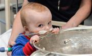 18 September 2017; Dara Cahill, age 9 months, from Clontarf, with the Sam Maguire Cup during the All-Ireland Senior Football Champions visit to Temple Street Children's Hospital in Dublin. Photo by Piaras Ó Mídheach/Sportsfile