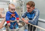 18 September 2017; Dublin footballer Michael Fitzsimons with Dara Cahill, age 9 months, from Clontarf, during the All-Ireland Senior Football Champions visit to Temple Street Children's Hospital in Dublin. Photo by Piaras Ó Mídheach/Sportsfile