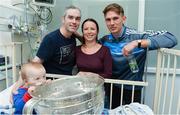 18 September 2017; Dublin footballer Michael Fitzsimons with Dara Cahill, age 9 months, from Clontarf, and his mother Niamh and father Brian, during the All-Ireland Senior Football Champions visit to Temple Street Children's Hospital in Dublin. Photo by Piaras Ó Mídheach/Sportsfile