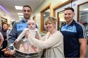 18 September 2017; Dublin footballers James McCarthy, left, and Philly McMahon with Mark Kane, age 5 months, and his mother Karen, from Cooley, Co Louth, during the All-Ireland Senior Football Champions visit to Temple Street Children's Hospital in Dublin. Photo by Piaras Ó Mídheach/Sportsfile