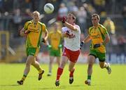30 June 2012; Martin Penrose, Tyrone, in action against Karl Lacey, Donegal. Ulster GAA Football Senior Championship Semi-Final, Tyrone v Donegal, St Tiernach's Park, Clones, Co. Monaghan. Picture credit: Oliver McVeigh / SPORTSFILE