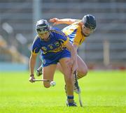 30 June 2012; Ereena Fryday,Tipperary, in action against Susan Vaughan, Clare. All-Ireland Senior Camogie Championship Round Two, Tipperary v Clare, Semple Stadium, Thurles, Co. Tipperary. Picture credit: Ray Lohan / SPORTSFILE
