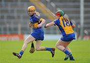 30 June 2012; Joanne Ryan, Tipperary, in action against Kate Lynch, Clare. All-Ireland Senior Camogie Championship Round Two, Tipperary v Clare, Semple Stadium, Thurles, Co. Tipperary. Picture credit: Ray Lohan / SPORTSFILE
