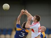 30 June 2012; Emmett McGuigan, Derry, in action against Barry Gilleran, 3, and Dermot Brady, Longford. GAA Football All-Ireland Senior Championship Qualifier Round 1, Longford v Derry, Glennon Brothers Pearse Park, Co. Longford. Picture credit: Ray McManus / SPORTSFILE