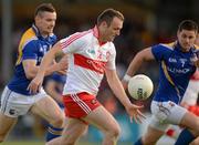 30 June 2012; Paddy Bradley, Derry, in action against Shane Mulligan, left, and Barry Gilleran, Longford. GAA Football All-Ireland Senior Championship Qualifier Round 1, Longford v Derry, Glennon Brothers Pearse Park, Co. Longford. Picture credit: Ray McManus / SPORTSFILE
