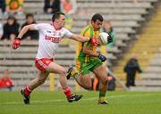 30 June 2012; Frank McGlynn, Donegal, in action against Aidan McCrory, Tyrone. Ulster GAA Football Senior Championship Semi-Final, Tyrone v Donegal, St Tiernach's Park, Clones, Co. Monaghan. Picture credit: Oliver McVeigh / SPORTSFILE