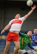 30 June 2012; Emmett McGuckian, Derry, wins possession ahead of the Longford goalkeeper Damien Sheridan. GAA Football All-Ireland Senior Championship Qualifier Round 1, Longford v Derry, Glennon Brothers Pearse Park, Co. Longford. Picture credit: Ray McManus / SPORTSFILE