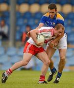 30 June 2012; Sean Leo McGoldrick, Derry, in action against Brendan McElvaney, Longford. GAA Football All-Ireland Senior Championship Qualifier Round 1, Longford v Derry, Glennon Brothers Pearse Park, Co. Longford. Picture credit: Ray McManus / SPORTSFILE