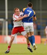 30 June 2012; Shane Mulligan, Longford, is tackled by Martin Donaghy, Derry. GAA Football All-Ireland Senior Championship Qualifier Round 1, Longford v Derry, Glennon Brothers Pearse Park, Co. Longford. Picture credit: Ray McManus / SPORTSFILE