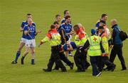 30 June 2012; Longford players applaud their team-mate John Keegan as his carried off injured early in the second half. GAA Football All-Ireland Senior Championship Qualifier Round 1, Longford v Derry, Glennon Brothers Pearse Park, Co. Longford. Picture credit: Ray McManus / SPORTSFILE