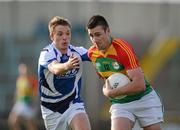 30 June 2012; Eoghan Ruth, Carlow, in action against Ross Munnelly, Laois. GAA Football All-Ireland Senior Championship Qualifier Round 1, Laois v Carlow, O'Moore Park, Portlaoise, Co. Laois. Picture credit: Daire Brennan / SPORTSFILE
