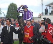 30 June 2012; Camelot, with Joseph O'Brien up, is led into the parade ring after winning the Dubai Duty Free Irish Derby. Irish Derby Festival, Curragh Racecourse, The Curragh, Co. Kildare. Picture credit: Barry Cronin / SPORTSFILE