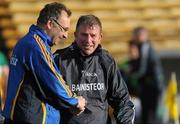30 June 2012; Tipperary Manager Peter Creedon, left, shakes hands with Offaly Manager Tom Coffey after the final whistle. GAA Football All-Ireland Senior Championship Qualifier Round 1, Tipperary v Offaly, Semple Stadium, Thurles, Co. Tipperary. Picture credit: Ray Lohan / SPORTSFILE