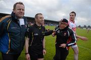 30 June 2012; The Derry manager John Brennan and substitute Joe Diver remonstrate with referee Michael Duffy as he is escorted off the pitch by Secretary Peter O'Reilly after the game. GAA Football All-Ireland Senior Championship Qualifier Round 1, Longford v Derry, Glennon Brothers Pearse Park, Co. Longford. Picture credit: Ray McManus / SPORTSFILE