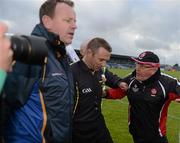 30 June 2012; The Derry manager John Brennan  remonstrates with referee Michael Duffy as he is escorted off the pitch by Secretary Peter O'Reilly after the game. GAA Football All-Ireland Senior Championship Qualifier Round 1, Longford v Derry, Glennon Brothers Pearse Park, Co. Longford. Picture credit: Ray McManus / SPORTSFILE