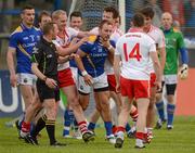 30 June 2012; Referee Michael Duffy looks on as the Derry and Longford players jostle each other. GAA Football All-Ireland Senior Championship Qualifier Round 1, Longford v Derry, Glennon Brothers Pearse Park, Co. Longford. Picture credit: Ray McManus / SPORTSFILE