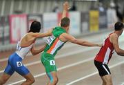 30 June 2012; Ireland's Jason Harvey is jostled by his Russian counterpart before they ran the final leg of the Men's 4x400m semi-final. European Athletics Championship, Day 4, Olympic Stadium, Helsinki, Finland. Picture credit: Brendan Moran / SPORTSFILE