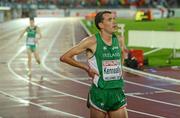 30 June 2012; Ireland's Mark Kenneally watches for his finishing time after finishing in 15th as team-mate David Rooney crosses the line behind in 20th place in the Men's 10000m Final. European Athletics Championship, Day 4, Olympic Stadium, Helsinki, Finland. Picture credit: Brendan Moran / SPORTSFILE