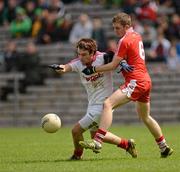 30 June 2012; James McGahan, Tyrone, in action against Michael Sweeney, Derry. Electric Ireland Ulster GAA Football Minor Championship Semi-Final, Derry v Tyrone, St Tiernach's Park, Clones, Co. Monaghan. Picture credit: Oliver McVeigh / SPORTSFILE