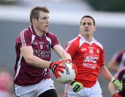 30 June 2012; Kieran Martin, Westmeath, in action against David Reid, Louth. GAA Football All-Ireland Senior Championship Qualifier Round 1, Westmeath v Louth, Cusack Park, Mullingar, Co. Westmeath. Picture credit: David Maher / SPORTSFILE