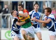 30 June 2012; Brendan Murphy, Carlow, in action against Paul Cahillane, left, and Kevin Meaney, Laois. GAA Football All-Ireland Senior Championship Qualifier Round 1, Laois v Carlow, O'Moore Park, Portlaoise, Co. Laois. Picture credit: Daire Brennan / SPORTSFILE