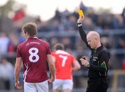 30 June 2012; Referee Derek Fahy shows a second yellow card to John Heslin, Westmeath, before sending the player off. GAA Football All-Ireland Senior Championship Qualifier Round 1, Westmeath v Louth, Cusack Park, Mullingar, Co. Westmeath. Picture credit: David Maher / SPORTSFILE