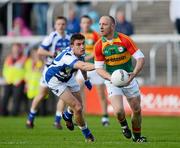 30 June 2012; Paul Reid, Carlow, in action against Colm Begley, Laois. GAA Football All-Ireland Senior Championship Qualifier Round 1, Laois v Carlow, O'Moore Park, Portlaoise, Co. Laois. Picture credit: Daire Brennan / SPORTSFILE