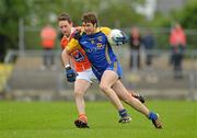 1 July 2012; Cathal Cregg, Roscommon, in action against Finnian Moriarty, Armagh. GAA Football All-Ireland Senior Championship Qualifier Round 1, Roscommon v Armagh, Dr. Hyde Park, Co. Roscommon. Picture credit: Barry Cregg / SPORTSFILE