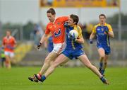 1 July 2012; Cathal Cregg, Roscommon, in action against Finnian Moriarty, Armagh. GAA Football All-Ireland Senior Championship Qualifier Round 1, Roscommon v Armagh, Dr. Hyde Park, Co. Roscommon. Picture credit: Barry Cregg / SPORTSFILE